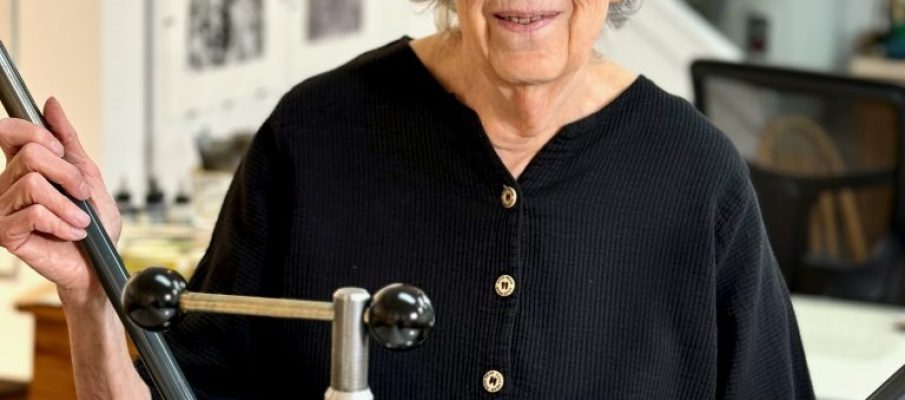 Sheila Sondik in her studio with her printing press